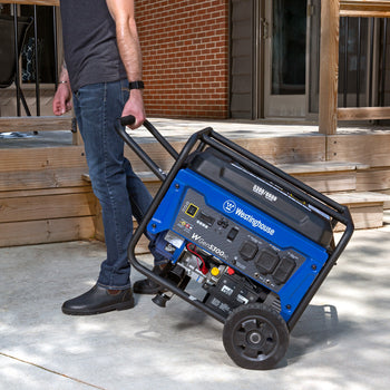 Westinghouse | WGen5300sc portable generator shown being pulled to a backyard with a patio in the background.