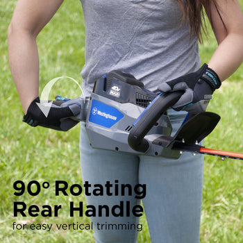 A woman is holding a hedge trimmer and rotating the rear handle. Text at the bottom of the image says 