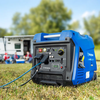 Westinghouse | iGen4500c inverter generator sitting in grass with a camper and people in the background.