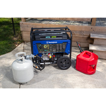 Westinghouse | WGen7500DFc portable generator shown being hooked up to a propane tank with a gas can sitting beside the generator. The generator is sitting on the concrete in front of a patio